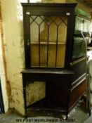 A late 19thC carved and glazed mahogany corner cupboard with undershelf (H175cm)