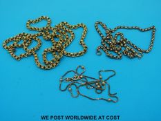 Two yellow metal necklaces marked 9ct gold and another yellow metal necklace (26.