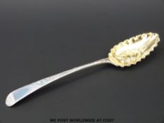A George III hallmarked silver spoon with embossed mask to bowl, London 1795,