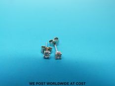 A pair of 18ct white gold earrings set with diamonds