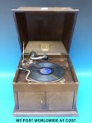 A c1930 HMV model 103 wind up gramophone in oak case with louvre type speaker outlet and door to