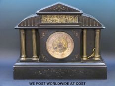 A two train slate mantel clock in classical style with pierced dial decoration, spade hands,