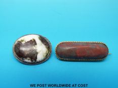 A yellow metal brooch set with bloodstone and a silver brooch set with agate.
