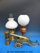 A brass cannon, miners lamp,
