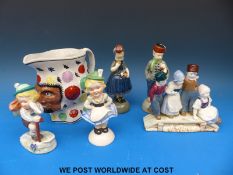 A collection of continental china figures including Dutch girls and boys, a pair of Bavarian hikers,