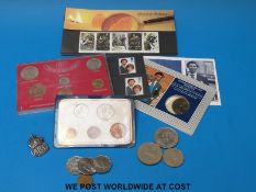 A collection of coins and stamps to include three commemorative 50p's and an A. R.