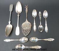 A set of six white metal spoons marked sterling,