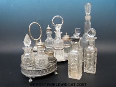 A four bottle silver plated cruet set together with a further cruet and various cut glass bottles
