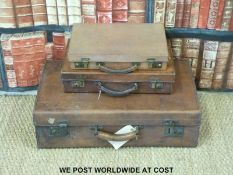 Three vintage leather suitcases (largest 66 x 41cm)