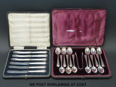 Twelve hallmarked silver teaspoons and tongs in case (186g) together with a cased set of hallmarked
