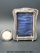 A hallmarked silver Art Nouveau style picture frame together with one other,