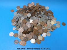 A large collection of British coinage including half crowns and pennies.