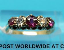 An 18ct gold ring set with alternating rubies and diamonds (size L)