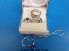 A silver ring set with cubic zirconia in bands,