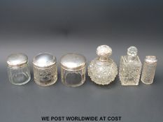 A collection of hallmarked silver-mounted cut glass dressing table items
