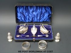 A cased hallmarked silver cruet set,