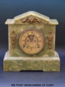 A 19th century green onyx mantel clock, with brass coloured dial, Roman numerals,