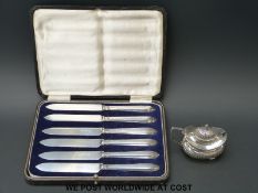 A hallmarked silver mustard pot and cased set of hallmarked silver-handled knives