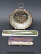 An Issachar, Cheltenham, glass faced aneroid brass cased barometer (16.