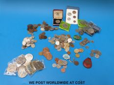 A quantity of world coinage including crowns pre 1947 and 1920 silver etc