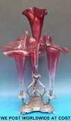 A silver plated epergne with four cranberry glass flutes (height 47cm)