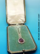 WITHDRAWN An Art Deco platinum necklace set with a pear cut ruby measuring approximately 5ct