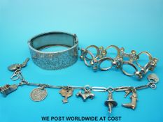 A large white metal bangle,