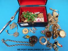 A small jewellery box containing a quantity of costume jewellery to include Miracle and Exquisite