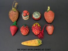 A collection of late 18th / 19thC embroidered pin cushions,