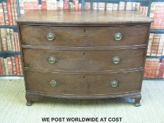 A 19thC mahogany bow fronted chest of three graduated drawers with brass drop handles,