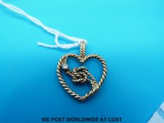 A 9ct gold heart pendant in rope twist design set with a diamond (3.
