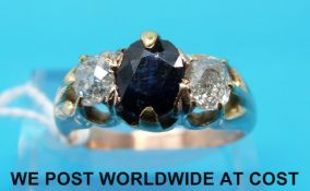 A yellow metal ring marked 15ct set with a an oval sapphire of approximately 1.