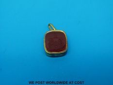 An 18ct gold intaglio fob set with blood stone to one side and carnelian agate to the other with