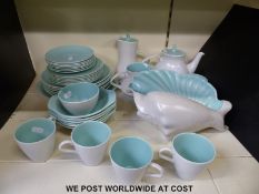 A Poole pottery tea set and a large Poole conch shell
