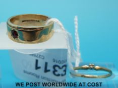 A 9ct gold ring set with a garnet and a 9ct gold ring set with a diamond