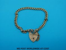 A 9ct gold curb link bracelet with padlock clasp (14.