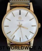 Tissot 9ct gold gentleman's wristwatch with luminous hands and two tone baton markers,