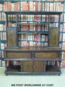 A 19th/20thC oak dresser with two cupboards and shelves above two straight drawers with cupboard