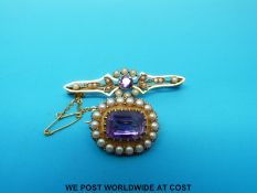 Two yellow metal brooches set with seed pearls and amethysts
