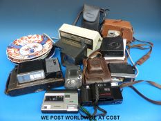 A collection of cameras including retro Argus Electromatic, folding examples,