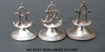 Three late 18thC cut steel fobs, all with monograms, tallest 2.