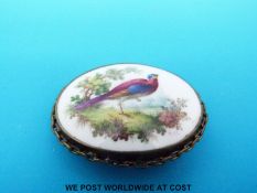 A hand painted brooch by G.