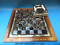 A chess board with butterfly wing decoration and chess set