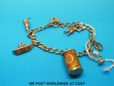 A 9ct gold charm bracelet with five 9ct gold charms and 9ct gold padlock clasp (21.