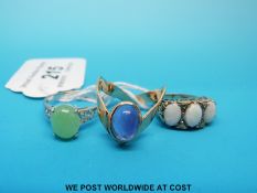 A 9ct gold ring set with three opals,