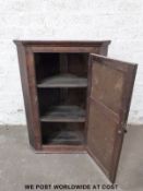 A 19thC oak corner cupboard (height 103cm)