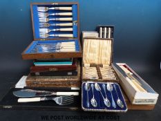 A large quantity of cased and boxed plated cutlery