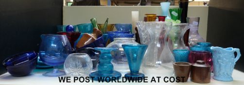 A collection of decorative coloured glassware to include Sowerby jug, Murano,