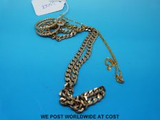 A yellow metal curb link chain marked 9ct gold (33.