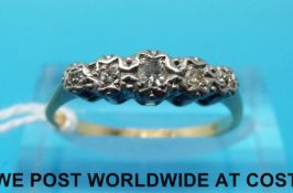 An 18ct gold ring set with five diamonds in a paltinum illusion setting (size N)